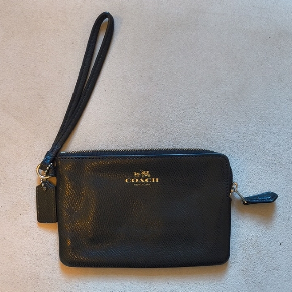 Coach Handbags - Coach Midnight Black Wristlet with Gold Accents